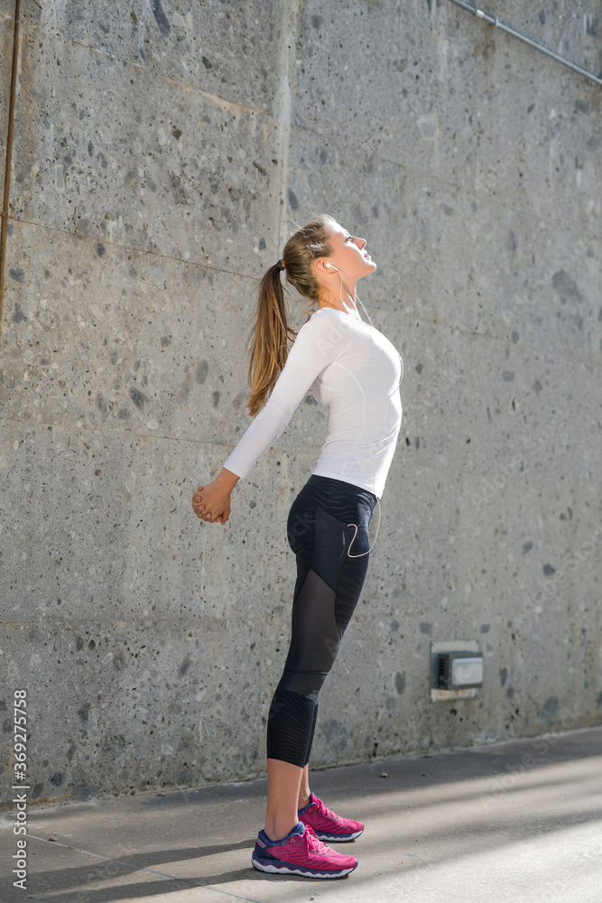 Fototapeta premium Athletic woman training in the urban area.