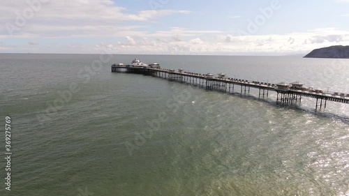 Wallpaper Mural Aerial view historic Llandudno pier landmark tourist seaside promenade landmark lower low over ocean Torontodigital.ca