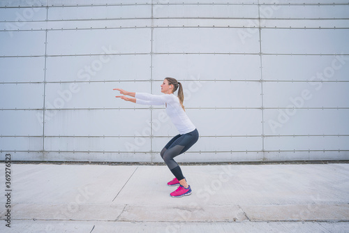 Athletic woman training in the urban area.