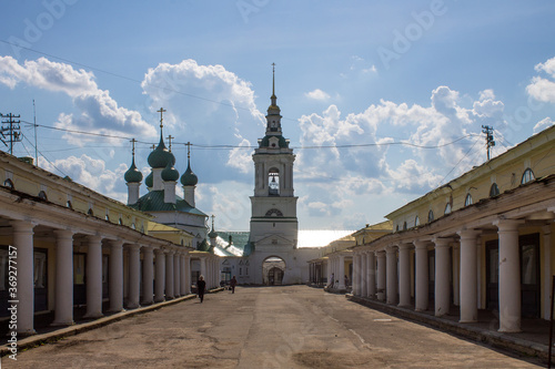 white stone Red rows with columns in the old city of Kostroma Russia on a clear summer day and space for copying photo