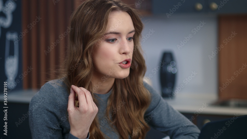 Portrait of upset businesswoman talking by video chat on computer at home office