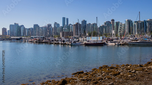 Coal Harbour and the Vancouver skyline. at low tide in summer from Stanley Park
