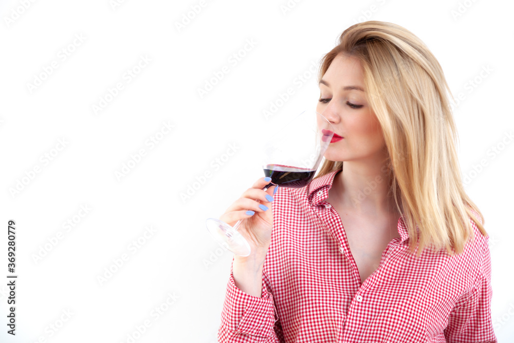 Young beautiful woman holding red wine glass on white background Young beautiful woman holding red wine glass on white background