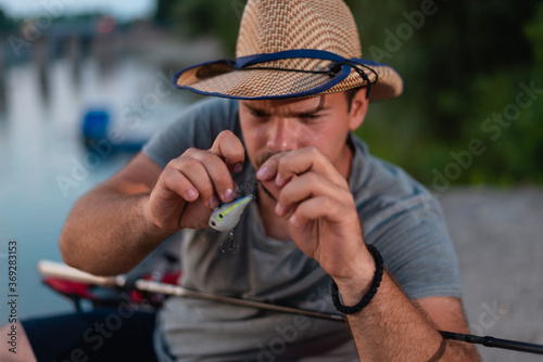 Fishing lure isolated with young fisherman in the background