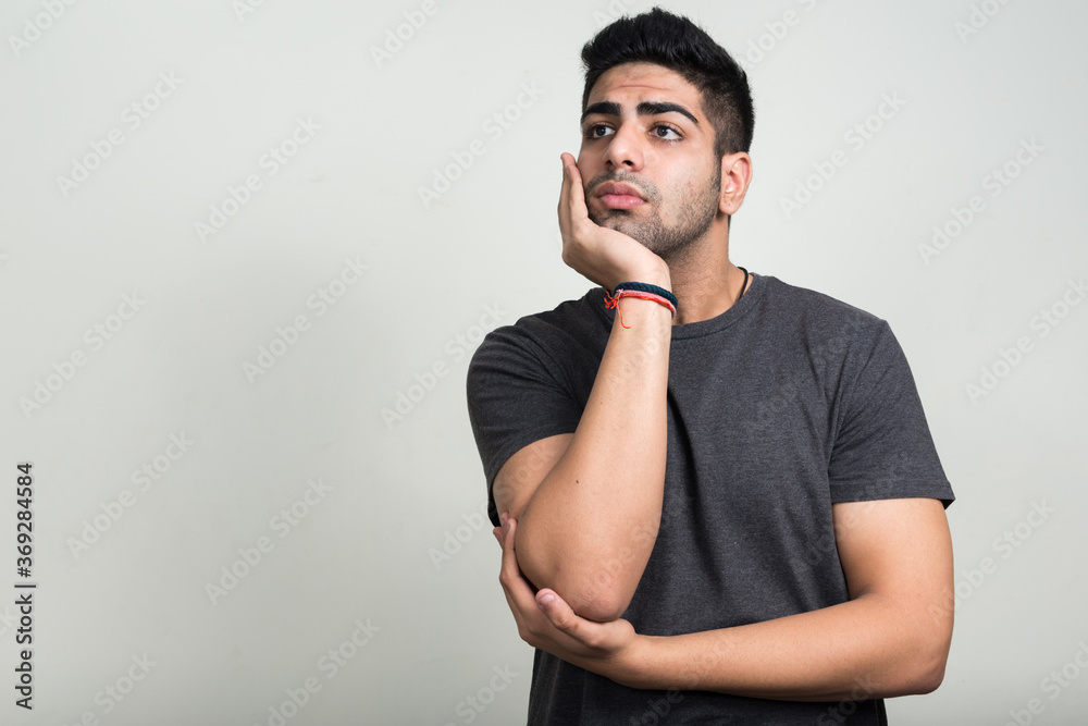 Portrait of young handsome bearded Indian man Portrait of young handsome bearded Indian man