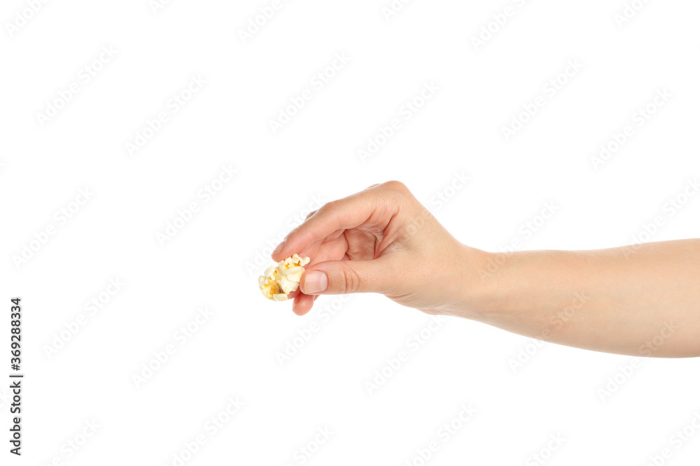 Female hand holds popcorn, isolated on white background Female hand holds popcorn, isolated on white background
