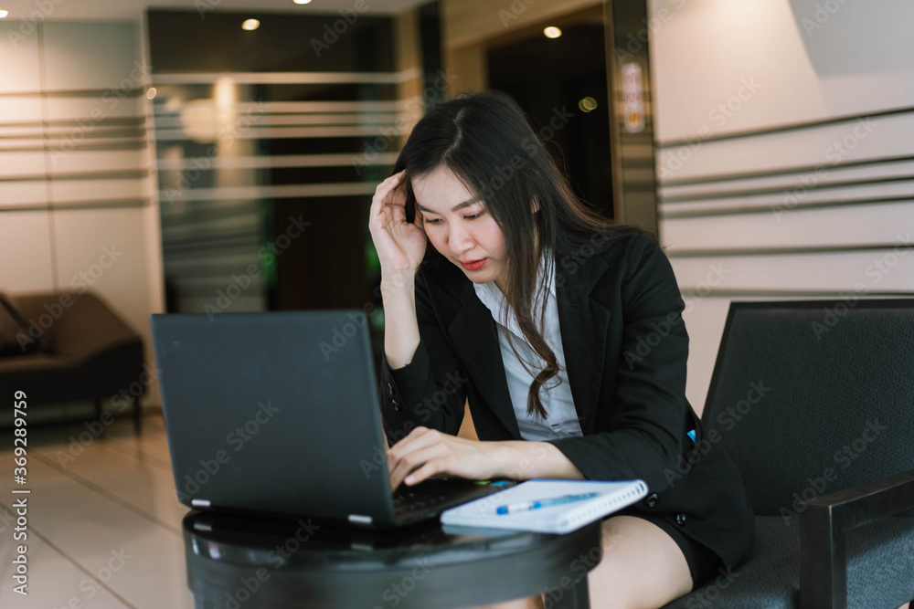 Beautiful young asian business woman with headache at office Beautiful young asian business woman with headache at office