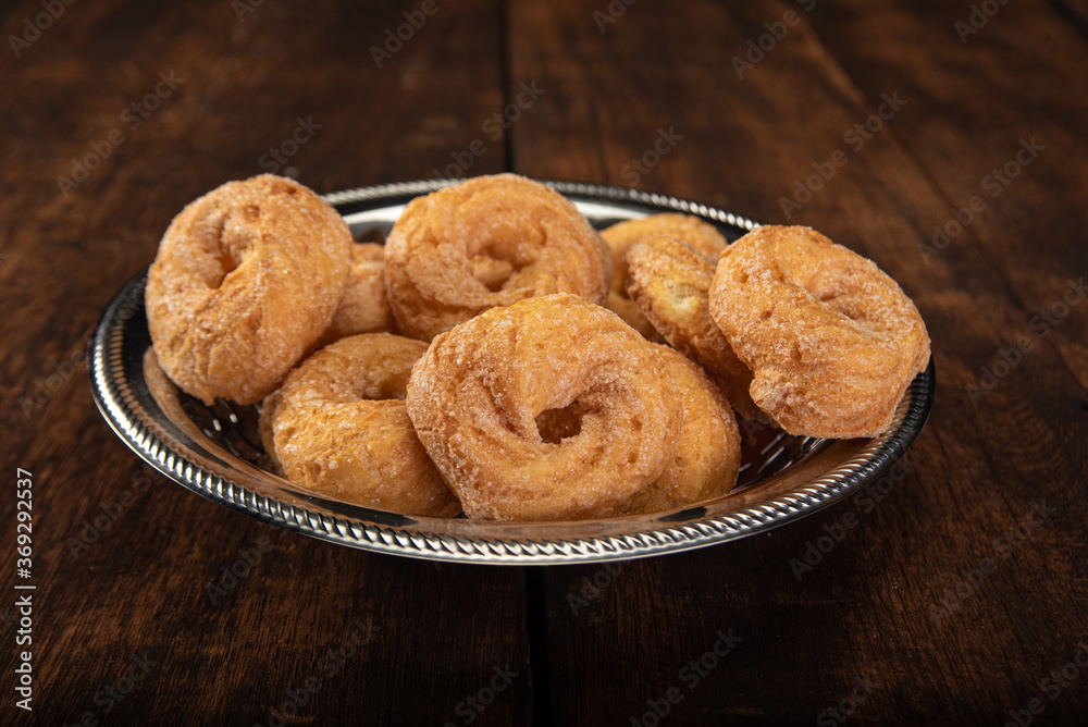 sweet cookies in a stainless steel container on rustic wood, selective focus sweet cookies in a stainless steel container on rustic wood, selective focus