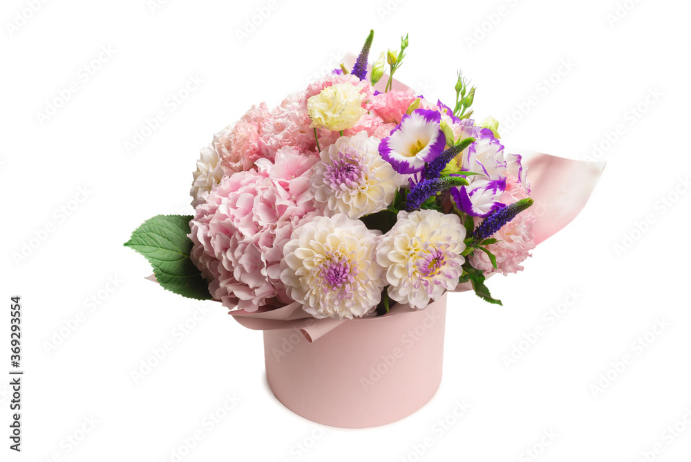 Pink and purple bouquet of flowers in a pink box isolated on white. Pink and purple bouquet of flowers in a pink box isolated on white.