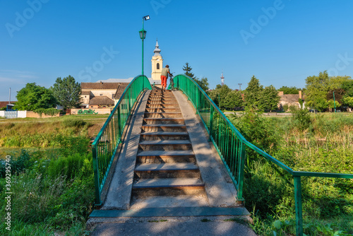 Quadro su tela Bac, Serbia - July 22, 2020: Pedestrian bridge for crossing the Danube-Tisa-Danube canal in the town of Bac
