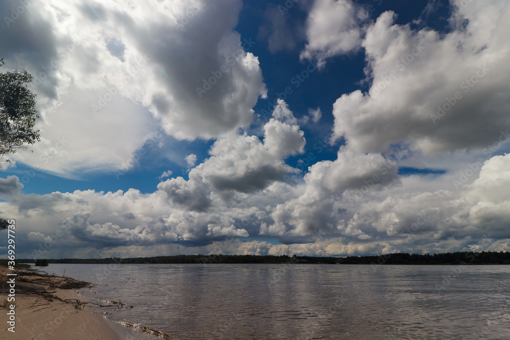 River and shore against the background of clouds River and shore against the background of clouds