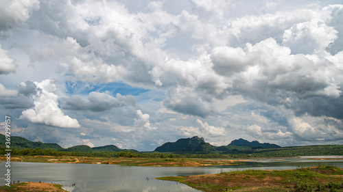 Mae Kham Reservoir with views on a day with beautiful rain clouds during the rainy season.