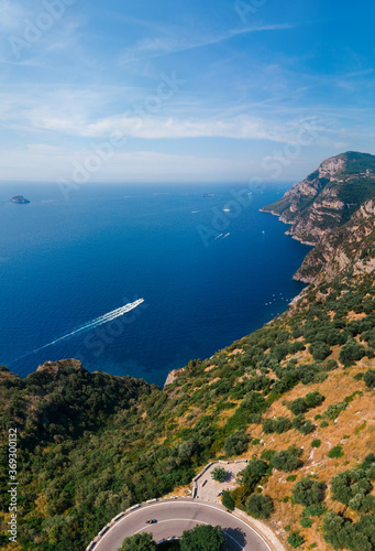 San Pietro viewpoint. Beautiful road to Positano, Amalfi, Salerno. Aerial view Italy mountains, the boat is moving sea. Travel tour concept, Summer sunny day, Vacation. Nature. Vertical photo