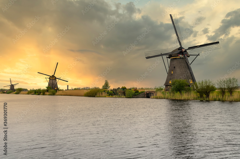 Fototapeta premium Windmills are the symbol of the Netherlands. Windmills are used in various fields of working