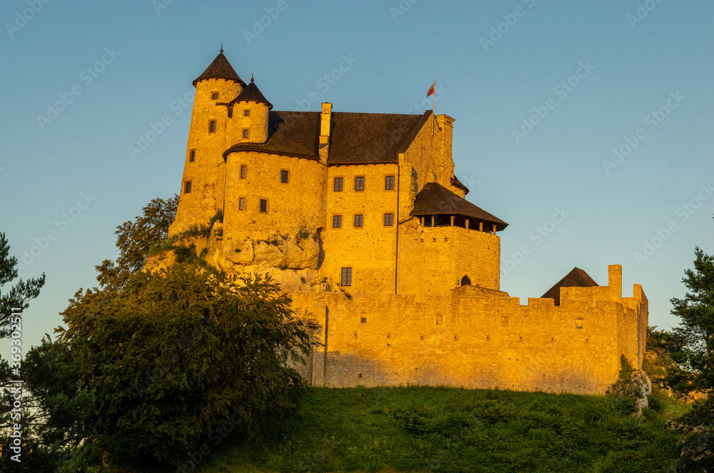 Bobolice Castle in Poland in the rays of the setting sun .The castle is part of the system of strongholds known as the Eagles' Nests