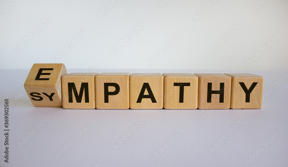Turned cube and changed the word 'sympathy' to 'empathy'. Beautiful white background. Copy space. Turned cube and changed the word 'sympathy' to 'empathy'. Beautiful white background. Copy space.