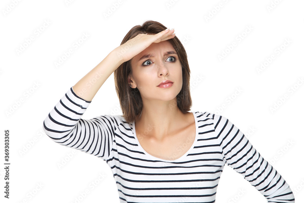 Beautiful young woman looking into distance isolated on white background Beautiful young woman looking into distance isolated on white background