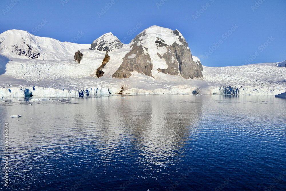 Antarctic landscape, glacier and mountain, with reflection in water, Antarctica Antarctic landscape, glacier and mountain, with reflection in water, Antarctica