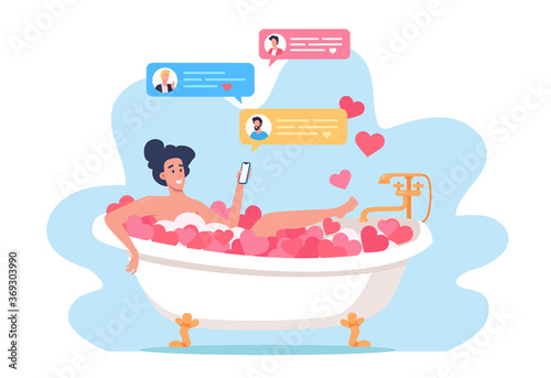 Young woman taking bath and sending messages 