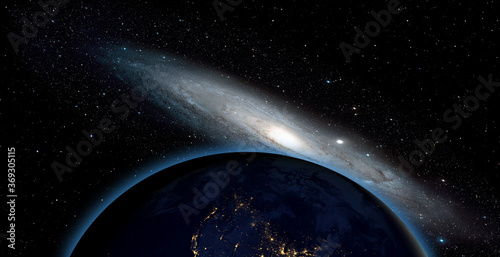 View of the planet Earth from space with The Andromeda Galaxy ( Messier 31) " Elements of this image furnished by NASA"