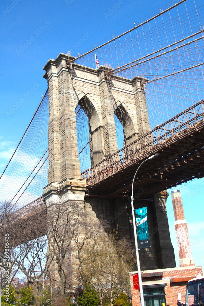 Fototapeta premium Famous Brooklyn Bridge in New York City, USA with beautiful blue sky, in black and white, monochrome, Manhattan, USA.