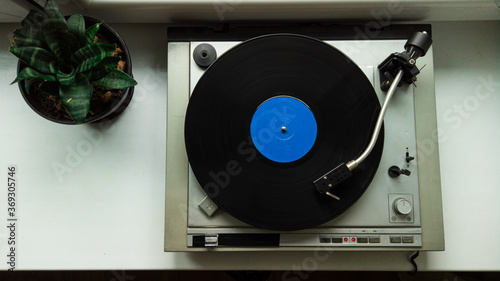 View from abov on vintage vinyl record player. Listening vinyl record