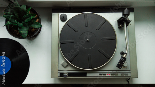 View from abov on vintage vinyl record player. Listening vinyl record