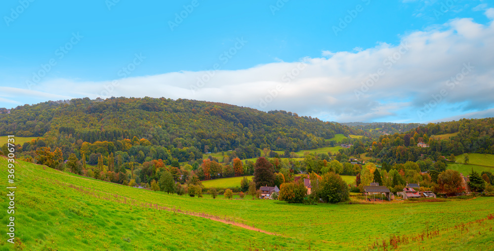 Fototapeta premium Panorama of the countryside in Wales with green field - View of green fields and farmlands in rural North Wales