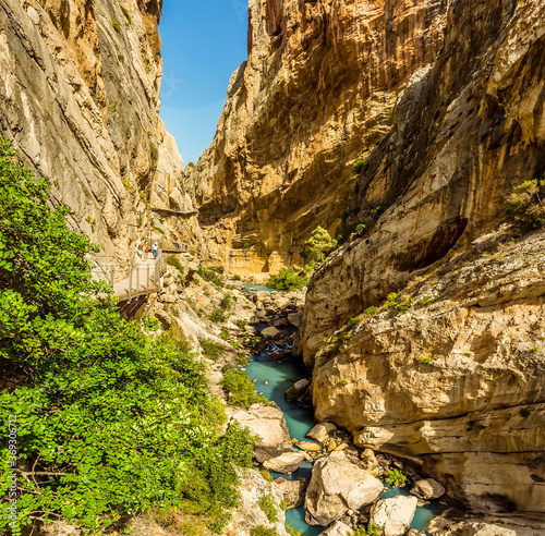 A view of the gorge of the Gaitanejo river and the Caminito del Rey pathway following its course near Ardales, Spain in the summertime