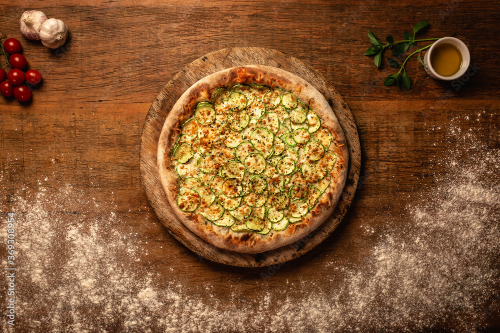 Top down pizza on wooden table for restaurant menu Top down pizza on wooden table for restaurant menu