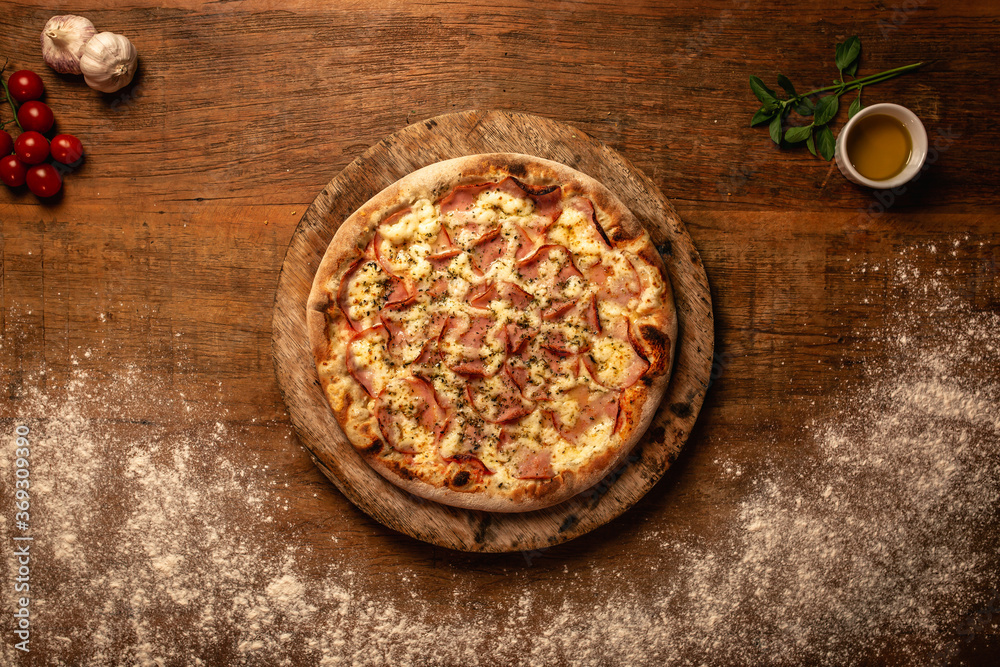 Top down pizza on wooden table for restaurant menu