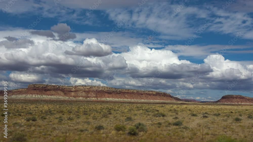 Driving plate of summer monsoon clouds over mesas in Utah Driving plate of summer monsoon clouds over mesas in Utah