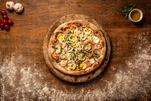 Top down pizza on wooden table for restaurant menu