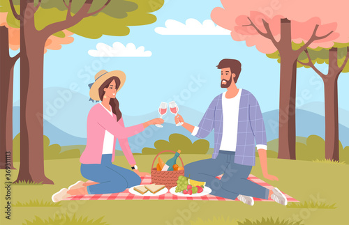 Romantic young couple on a picnic in a beautiful park