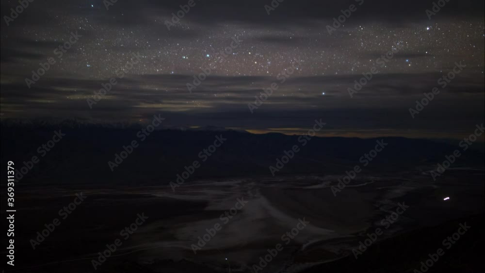 Time lapse of stars over salt flat at Badwater in Death Valley Time lapse of stars over salt flat at Badwater in Death Valley