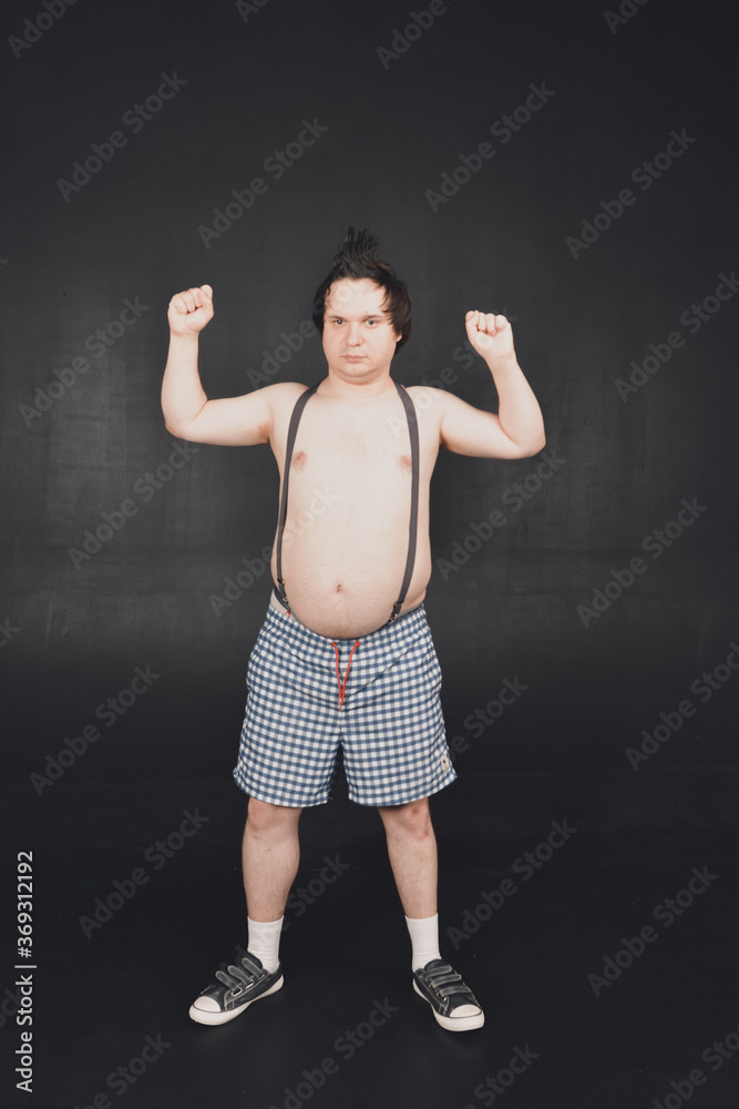 funny fat guy does physical exercises and moves in different poses funny fat guy does physical exercises and moves in different poses