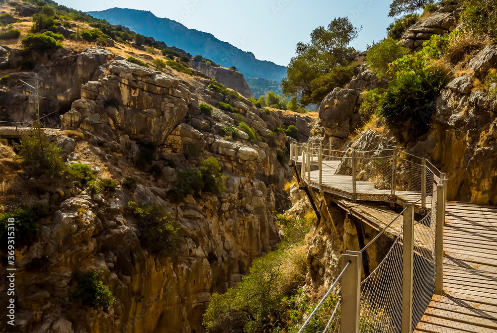 Fototapeta premium A close up view of the Caminito del Rey pathway suspended above the Gaitanejo river gorge near Ardales, Spain in the summertime