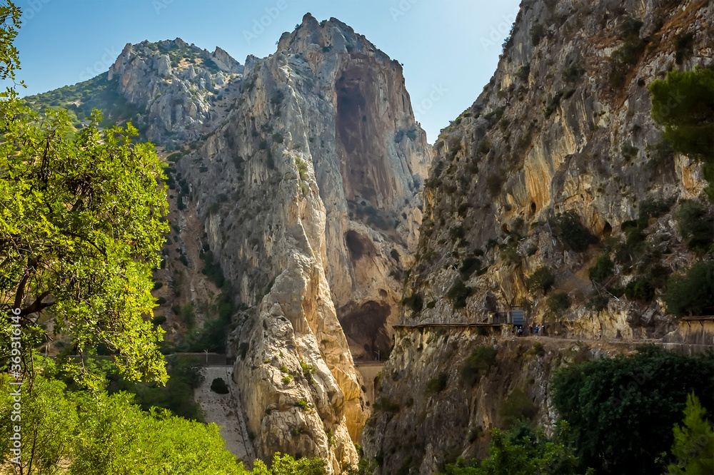 The Caminito del Rey pathway approaches the narrowest section of the Gaitanejo river gorge near Ardales, Spain in the summertime