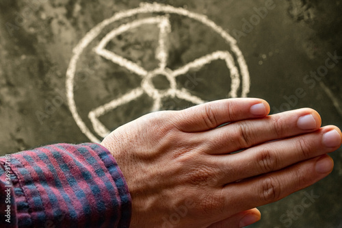 hand and nuclear weapon symbol concept renounce nuclear weapon photo