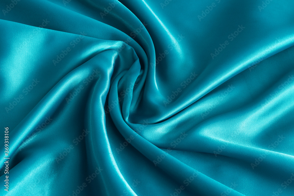 Fototapeta premium Aqua blue satin texture for background. Light blue satin fabric close up