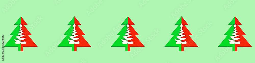 Seamless pattern with green christmas trees on a green background. Minimal composition pattern background of Christmas trees. New year and Christmas concept. Wide format banner Seamless pattern with green christmas trees on a green background. Minimal composition pattern background of Christmas trees. New year and Christmas concept. Wide format banner