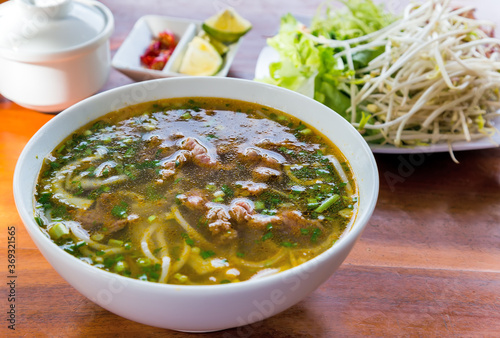 Pho Bo Vietnamese noodle soup with beef and herbs
