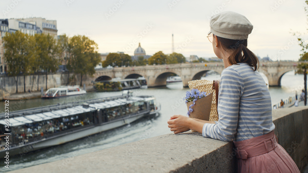 Young girl on a bridge in Paris