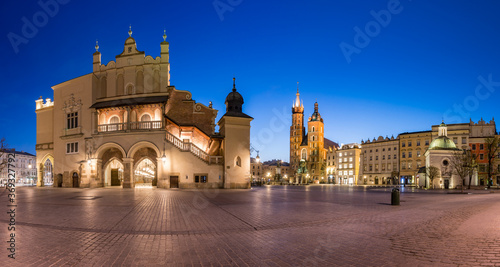 Krakow, Poland, main square night panorama with Cloth Hall and St Mary's church