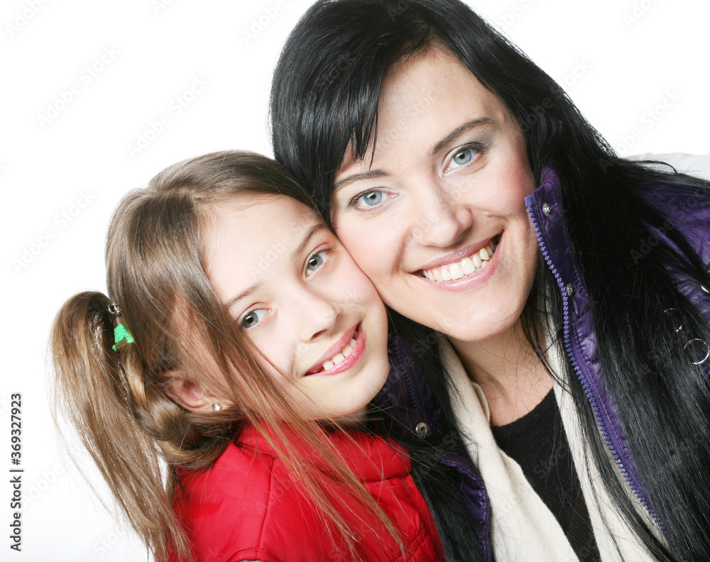 mother and her daughter smiling at the camera mother and her daughter smiling at the camera