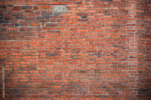 Weathered red brick wall background, texture