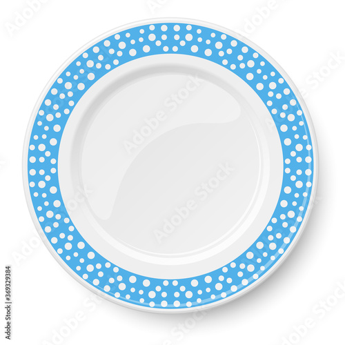 Blue plate with white polka dot pattern isolated on white background