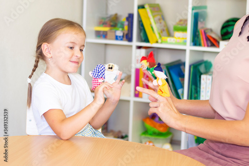 developmental and speech therapy classes with a child-girl. Speech therapy exercises and finger theater games.