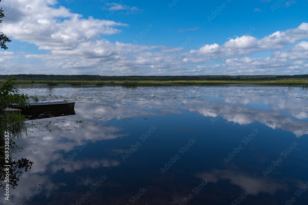 Cloud reflection in Okhotnichye (Hunters) Lake. Eco route in the 