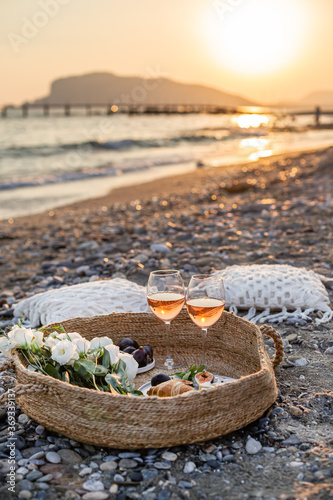 Summertime concept. Outdoor picnic with wine and croissants